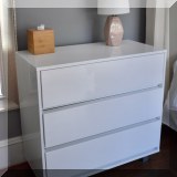 F29. White lacquered 3-drawer dresser. 34”h x 36”w x 18”d 